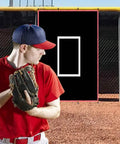 Baseball player pitching towards 4x6 ft batting cage backstop with all weather silver reflective edge vinyl backdrop and strike zone.