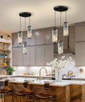 Three Light Black Pendant Light With Crystal Accents over a kitchen island, featuring adjustable height and industrial style.