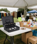Large Cash Box With Money Tray And Lock For Cash Handling And Small Biz Hustle on table at market stall, open showing money tray