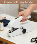 Portable Handheld Sewing Machine Kit For Beginners And Adults With Orange Leather Case in hand, showing USB powered feature