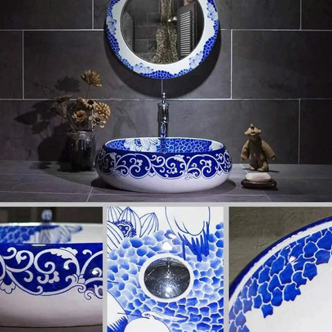 Slick Oval Vessel Sink For Bathroom Vanity Top Notch Premium Porcelain Countertop Wash Basin Featuring Hand Painted Lotus Bird Motif And Smooth High Gloss Finish in blue and white.
