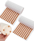 2000 Piece Self Adhesive Felt Furniture Pads 3 8 Inch Round Cabinet Door Bumpers shown on a roll with some applied to a ceramic object.