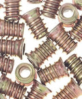 Twenty Pack M4x10mm Threaded Inserts For Wood, Tough As Nails Carbon Steel Screw In Furniture Nuts close-up view on solid surfaces.