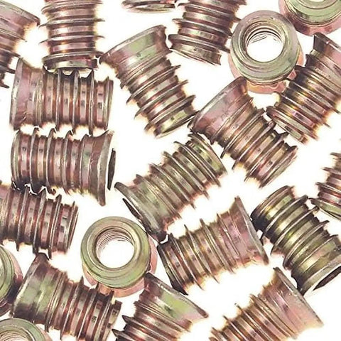 Twenty Pack M4x10mm Threaded Inserts For Wood, Tough As Nails Carbon Steel Screw In Furniture Nuts close-up view on solid surfaces.