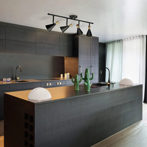 Dope Lofty Industrial Four Light Track Lighting Fixture With Pivoting Heads In Matte Black And Brass Accents installed in modern kitchen