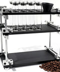 Single Dose Coffee Bean Container Coffee Station Organizer Rack With 8 Sealed Glass Vials One Way Valves And Dosing Funnels Kitchen Setup For Home Baristas Keeping The Grind Smooth on countertop with coffee beans.