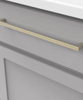 Solid Core Cabinet Pulls In Champagne Bronze, 12 Inch Center, Heavy Duty Luxury Hardware mounted on gray cabinet door.