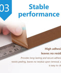 High Heat Resistant PTFE Tape For Sublimation Pressing And Vinyl Weeding being applied to a measuring ruler, showcasing strong adhesion.