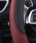 Close-up of Rhombus Microfiber Leather Steering Wheel Cover Universal Fit For Car Suv Truck Van With Padded Sides And Slick Grip In Black And Burgundy.