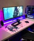 Pink Large Gaming Mouse Pad 31.5 By 11.8 Inches Desk Mat With Anti Skid Rubber Base used in a gaming setup with monitor and keyboard.