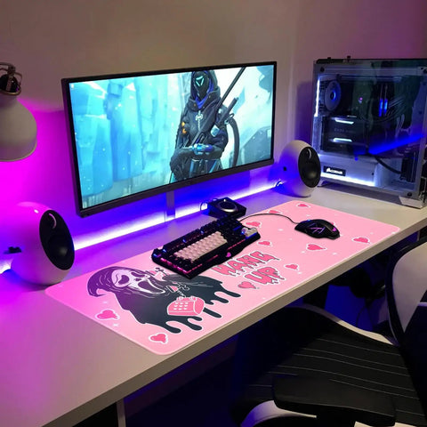 Pink Large Gaming Mouse Pad 31.5 By 11.8 Inches Desk Mat With Anti Skid Rubber Base used in a gaming setup with monitor and keyboard.