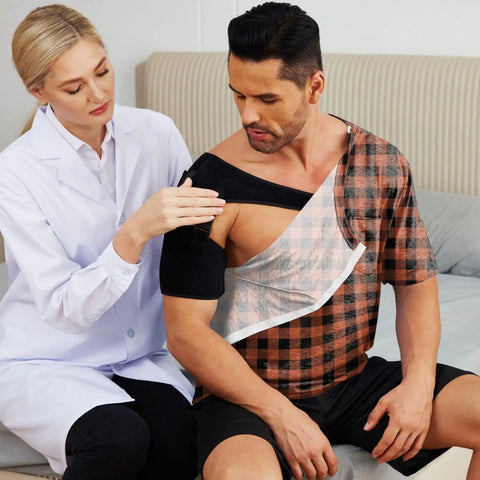Post Surgery Shirt For Men With Shoulder Recovery Easy Dress Snap Design worn by man during check-up, brown checkered pattern.