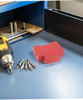Snap On Aerosol Fire Extinguisher Housing 4 Pack For Heavy Duty Industrial Electrical Panels With No Sweat Snap Installs and Reliable Flame Knockout Coverage Protection on a workbench.