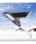 Heavy Duty 120W Solar Street Light With Motion Sensor Tough Aluminum Housing in snowy outdoor setting with solar panel