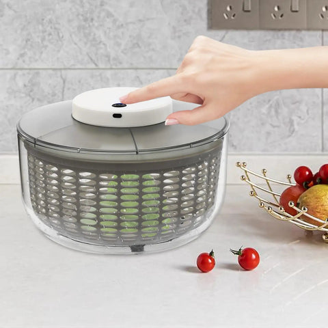 Game Changing Hella Big Electric Salad Spinner For Quick Lettuce Washing Knockout Battery Powered Produce Dryer with user pressing button.