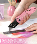 Front-angle view of WORKPRO pink folding utility knife with quick-change blade