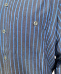 Close-up of Mens Charcoal Blue Stripe Long Sleeve Industrial Work Shirt Built Tough For Auto Mechanics And Trades Professionals Stain Resistant Heavy Duty Poly Cotton Blend With Secure Button Front Pockets Ready For The Daily Grind 2Xl.