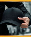 Person holding 8 Pack Baseball Bump Caps Safety Hard Hat Style With Breathable Shell And Detachable ABS Inner Shell Foam Pad.