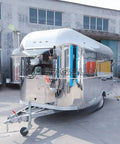 Fully Equipped Compact Concession Food Trailer Mobile Kitchen For Street Vending Hot Dog Coffee Cart Turnkey Setup with shiny steel exterior.