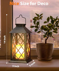 Outdoor Solar Lanterns 14 Inch Hanging LED Lights, 2 Pack with flickering flame look on windowsill beside plant