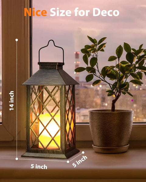 Outdoor Solar Lanterns 14 Inch Hanging LED Lights, 2 Pack with flickering flame look on windowsill beside plant