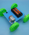 Assembled model from Six Direct Current Motors Included In A Six Set Motor Kit For Kids with green wheels and battery holder