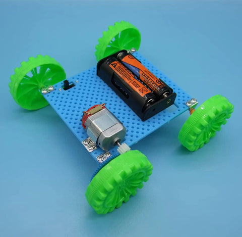 Assembled model from Six Direct Current Motors Included In A Six Set Motor Kit For Kids with green wheels and battery holder