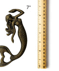 Heavy Duty Cast Iron Mermaid Bottle Opener For Beach House Kitchen Decor, Totally Rad Nautical Bar Essential, Thick Cast Metal Cap Lifter With Killer Coastal Design, Seven Inches next to a ruler