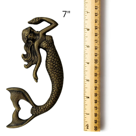 Heavy Duty Cast Iron Mermaid Bottle Opener For Beach House Kitchen Decor, Totally Rad Nautical Bar Essential, Thick Cast Metal Cap Lifter With Killer Coastal Design, Seven Inches next to a ruler