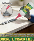 Heavy Hitter Concrete Crack Filler Water Based Sealer filling a crack on a countertop with gray sealant for repairs.