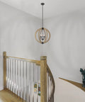 23 Inch 5 Light Modern Farmhouse Rustic Armillary Pendant Chandelier With Sphere Orb In White Ash Wood Finish And Galvanized Steel Finish Perfect For Dining Room Living Room Or Entryway Lighting installed in a hallway
