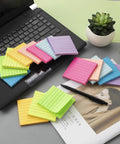 Lined Sticky Notes 3x3 Inches, 16 Pack With 56 Sheets Per Pad, Super Sticky Adhesive, shown on a desk with a laptop and plants