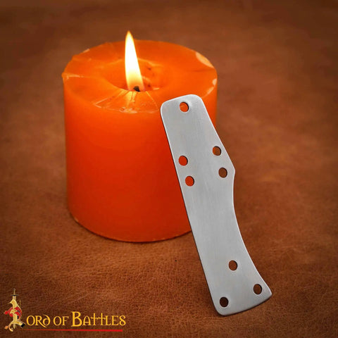 Beefy Steel Lamellar Armor Plates Set Of 100 For Reenactments 20 Gauge Craft Scale Medieval Armor showing single steel plate and candle