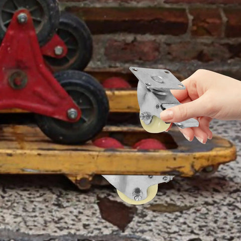 Heavy Duty 5 Inch Nylon Brake Caster Wheels With Rock Solid Stainless Steel Plate being held, showcasing its durable design and smooth wheels.