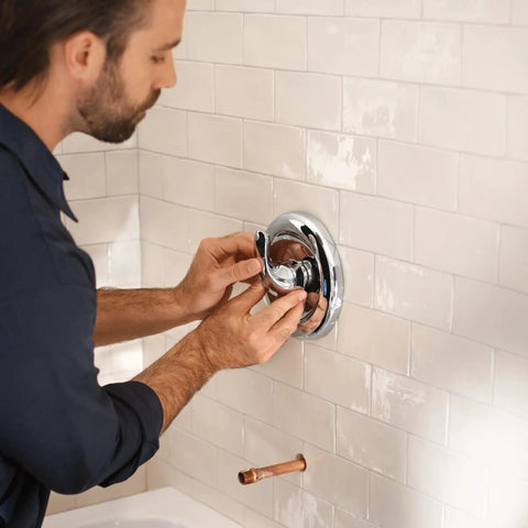 Man installing MPact PosiTemp Pressure Balancing Tub And Shower Valve With IPS Half Inch Connections Four Port Brass Valve Kit