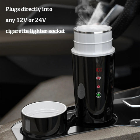 Road Warrior 420ml Portable Water Heater And 12V 24V Travel Kettle in car with steam, plugs into cigarette lighter socket.