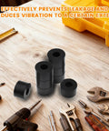 Set Of Eight Built Tough Black Rubber Spacers And Heavy Duty Backing Washers One Inch Outside Diameter With Three Eighths Inner Bore Thick Gasket Rings on a workbench with tools.