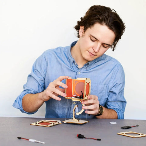 Young maker assembling Levitating Lantern STEM Kit For Kids 9 Plus, A Gravity Defying Physics Project And Robotics Gift