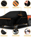 Installed Kistrba cab cover for mid-size crew-cab pickup; black fabric with orange reflective stripe.