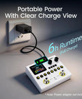 Dual Stomp Lite Multi Effects Guitar Pedal With 125 Effects, 99 Presets connected to a power outlet, showing charge status and digital display.
