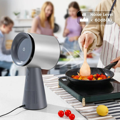 Heavy Duty Solder Fume Extractor Fan With Badass Suction And Slick Design For Desktop DIY Stations beside a cooking scene.