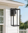 Lit Outdoor Wall Lantern Sconce 13.4 Inch Tall Anti Rust Metal Frame Weatherproof Exterior Light mounted on house exterior