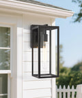 Rust-Resistant Outdoor Wall Lantern With Clear Glass, 13.4-Inch Tall Porch Light mounted on exterior white wall.