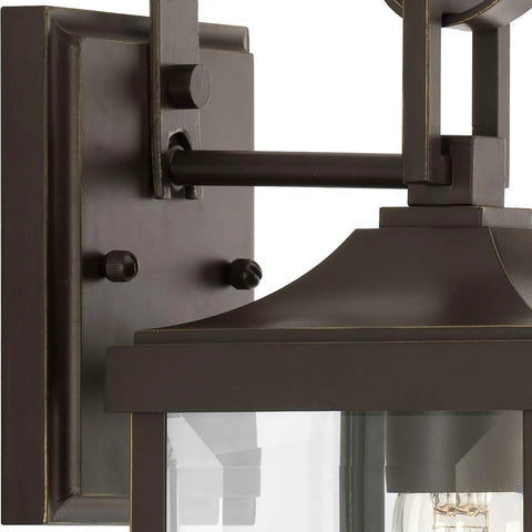 Close-up of Gibbes Street Collection 1 Light Outdoor Wall Lantern in Antique Bronze with clear beveled glass details.