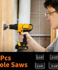 Person using The Ultimate 350 Piece Drill Bit Set For Home Repair And Furniture Assembly Packed With Masonry Bits Driver Bits Spade Bits Hole Saws And Hex Keys To Power Through Any Household Job Without Breaking A Sweat to drill a hole in wood.