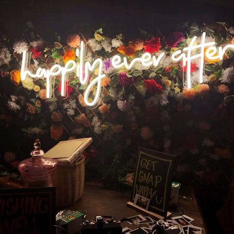 Happily Ever After Neon Sign LED Light for Weddings and Bridal Decor on floral backdrop, warm white glow 80 cm.