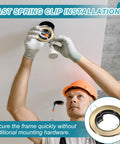 VIAPUICE GU10 Recessed Lighting Trims 2.1" Aperture with Spring Clip 2 Pcs installation, worker securing bronze downlight frame.