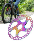 Rock Solid Metal Disc Brake Pads For Mountain Bikes With Five Nail Design Delivering Beast Mode Stopping Power Fits Hydraulic Mechanical Brakes 203mm Lightweight Killer Trail Replacement mounted on bicycle, showing colorful design.