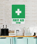 Right Arrow Green First Aid Sign 8x12 Inches Weatherproof Reflective Aluminum Plate displayed on brick wall
