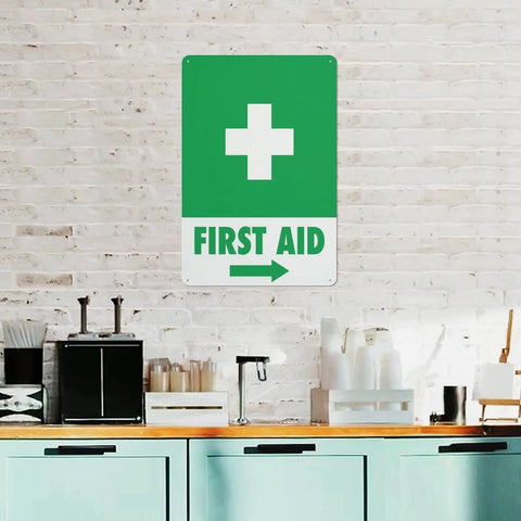 Right Arrow Green First Aid Sign 8x12 Inches Weatherproof Reflective Aluminum Plate displayed on brick wall